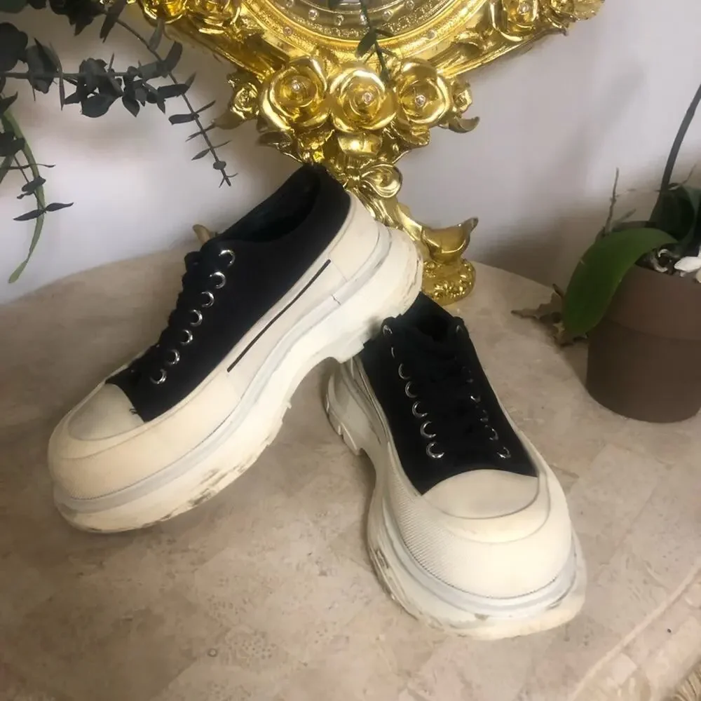 Alexander McQueen black and white platform chucks.